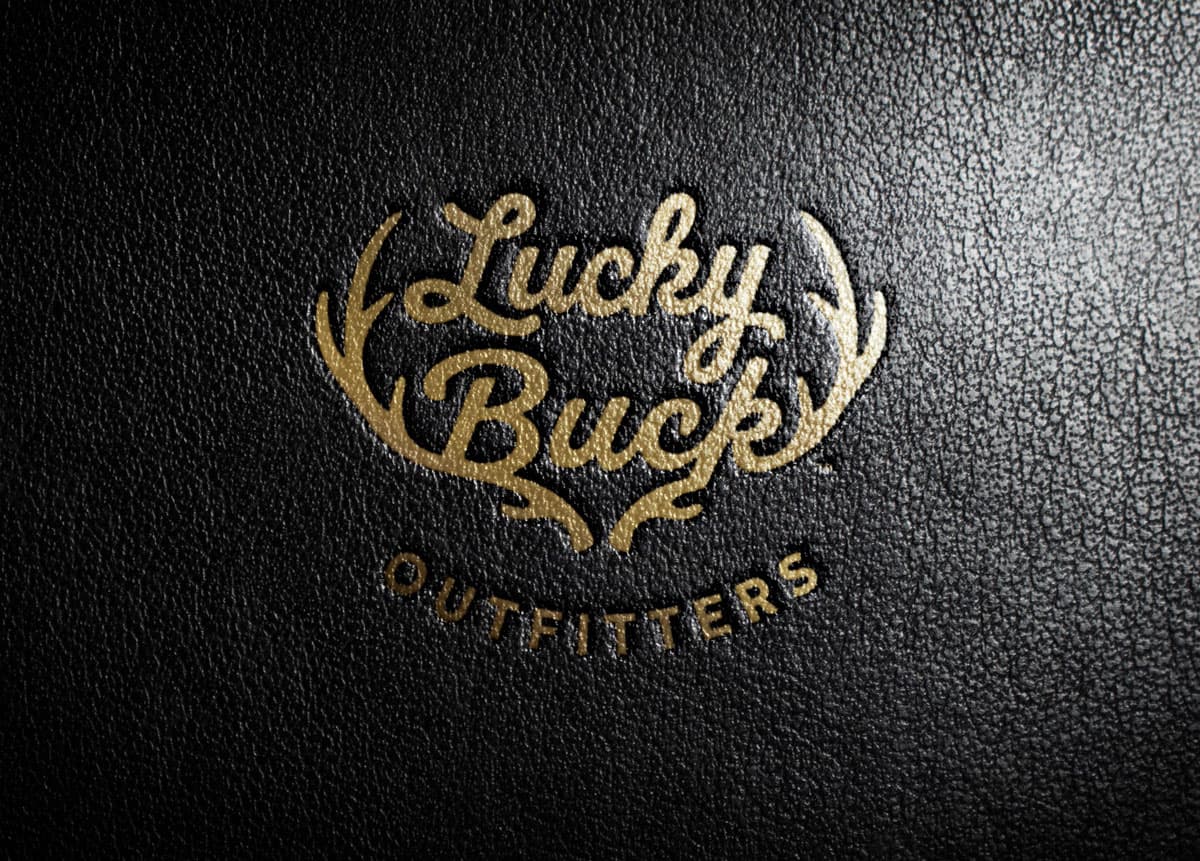 Lucky Buck Outfitters logo stamped in leather illustrating ag branding & packaging