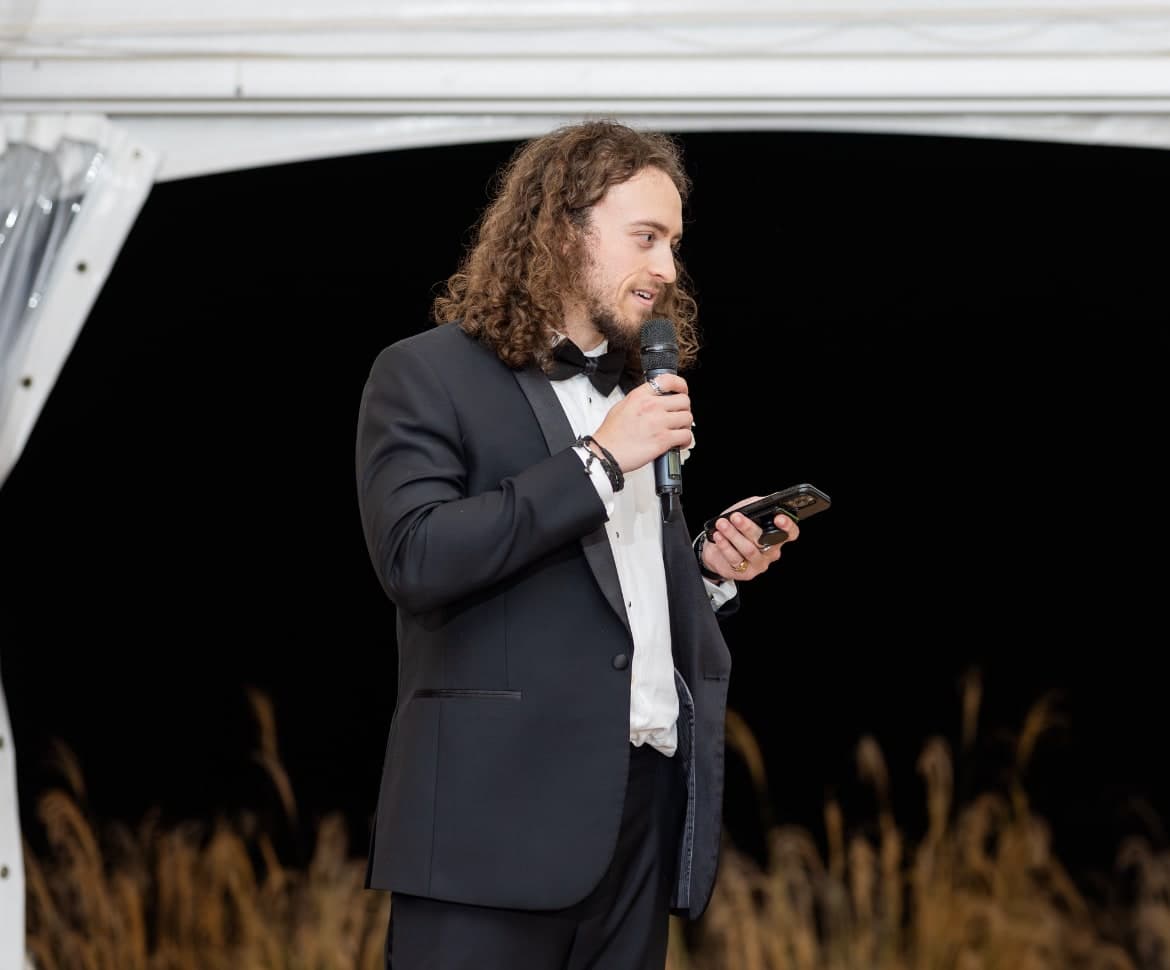 Ryan Palmer speaking at an evening event