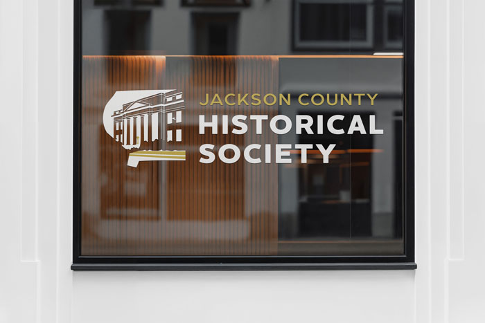 Historic society logo applied to a window sign