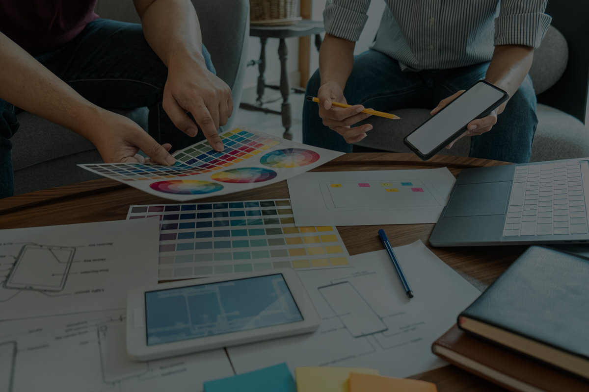 designers discussing color schemes for brand and logo design